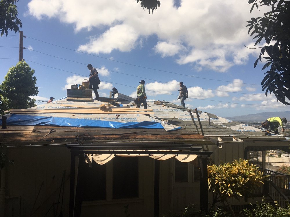 how-long-does-a-roof-replacement-take-in-hawaii ProBuilt Hawaii crew installing CertainTeed underlayment during a residential roof replacement under clear skies